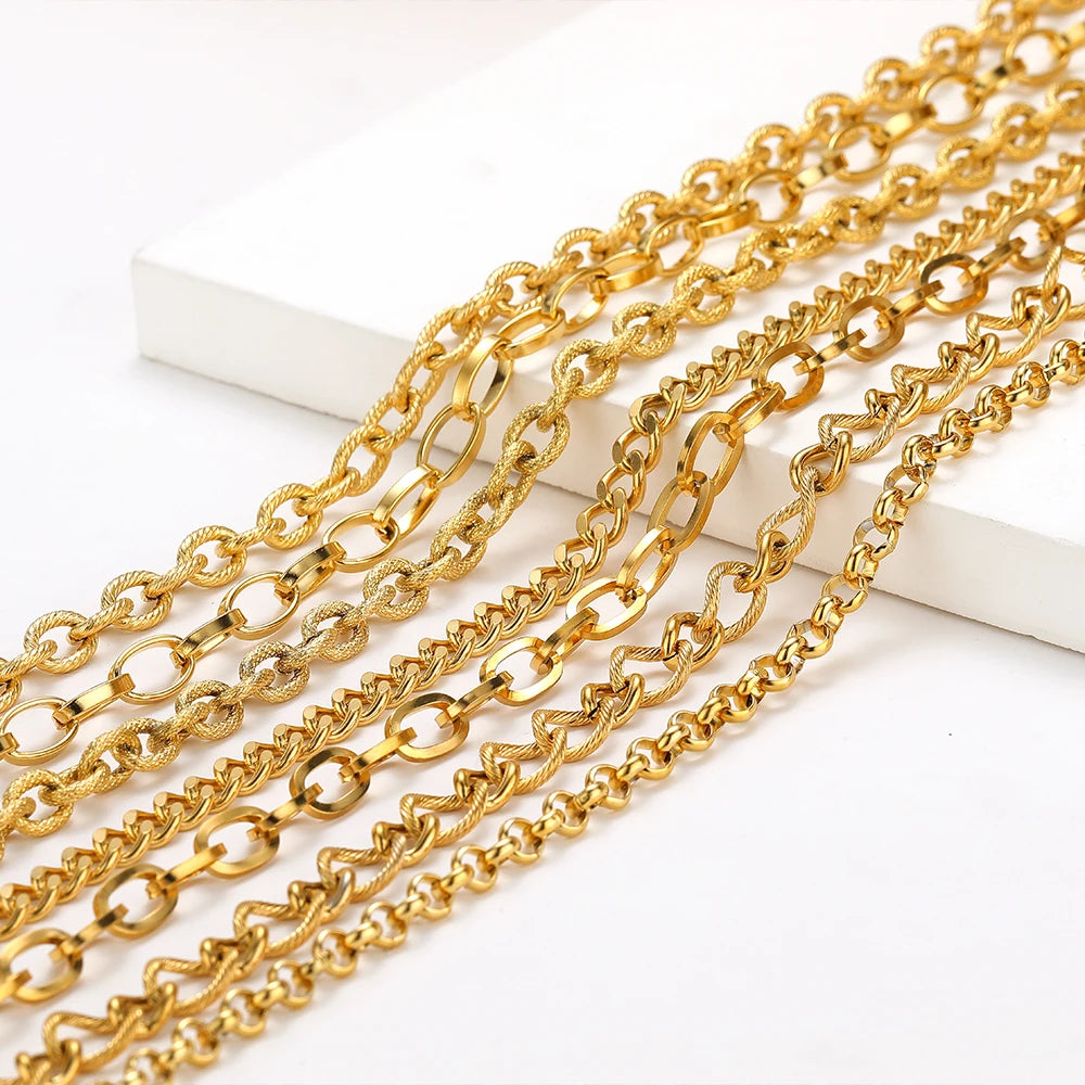 Gold Cuban link chain strands with chunky oval links on a white display block