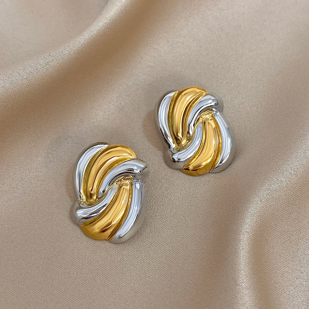 Gold and silver-tone twisted knot earrings