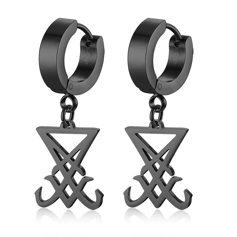 Black hoop earrings with dangling star-and-cross layered charm