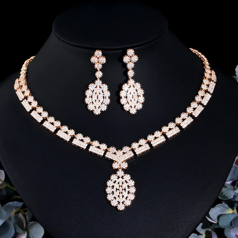 Gold-tone zirconia necklace with link rows and matching teardrop drop earrings