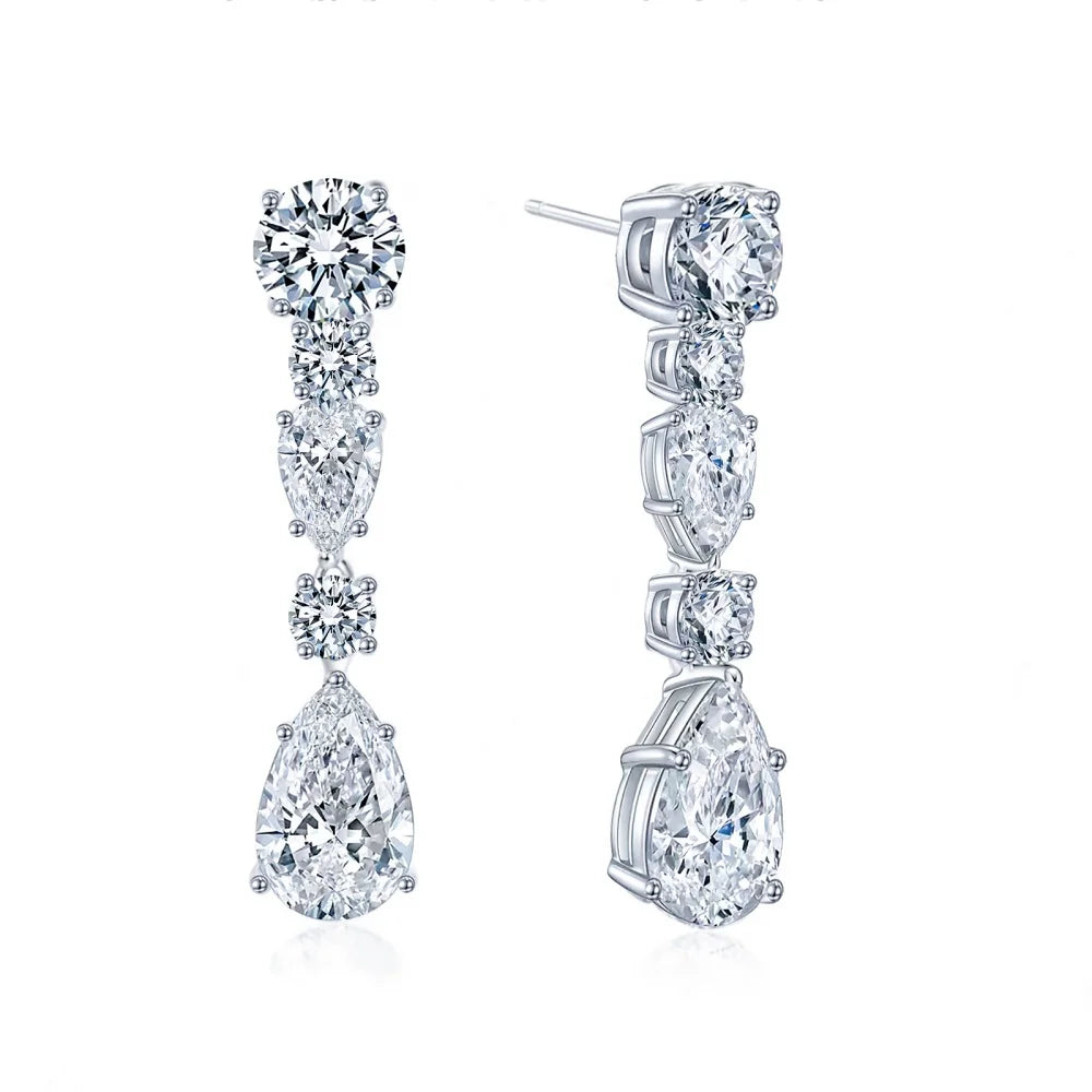 Cubic zirconia drop earrings with round, oval, and pear-shaped stones, front and side views.