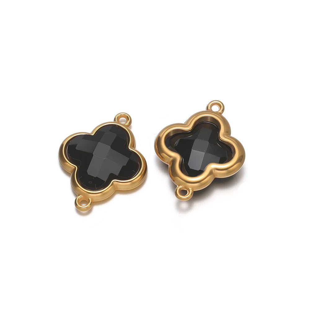 Four-leaf clover glass charm pendant with black gem and gold-tone loop