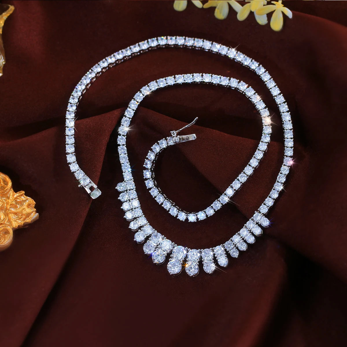 Cubic zirconia necklace with a row of teardrop-shaped stones and a bright metal chain