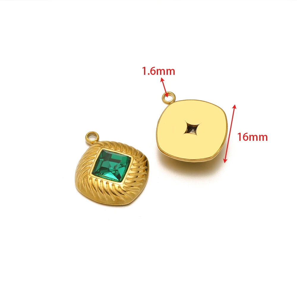 Gold heart-shaped rhinestone charm with green crystal and plain round back disc