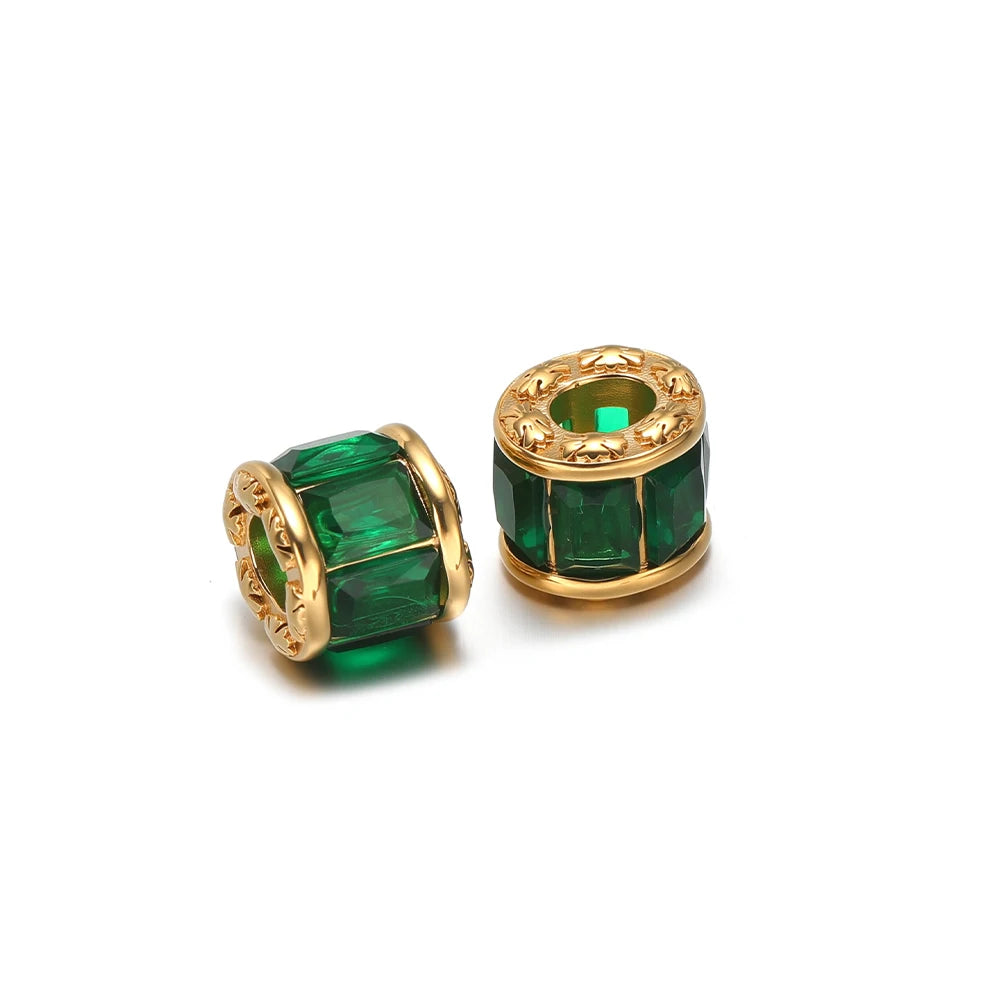 Gold-plated spacer beads with emerald-green crystal insets and gold rims