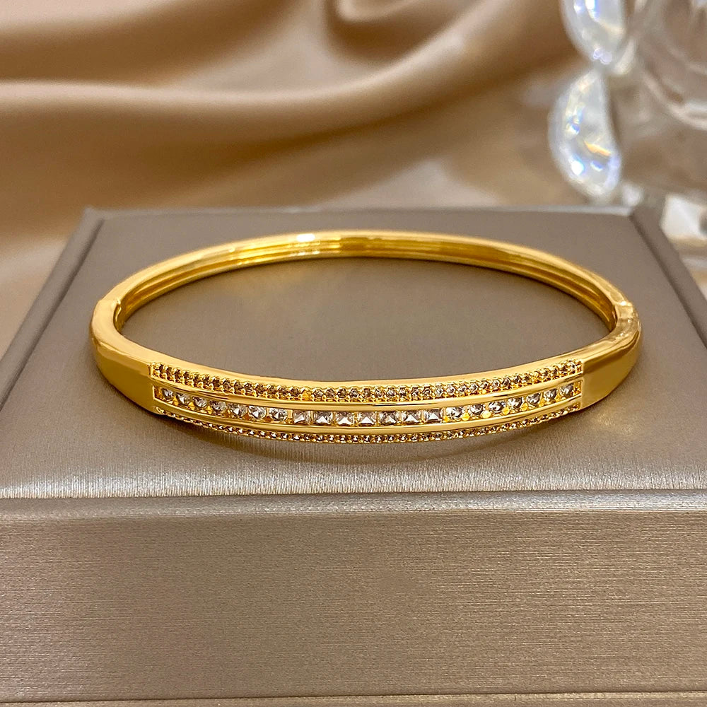 Gold-plated wide cuff bangle with micro zircon inlaid bands and geometric center line