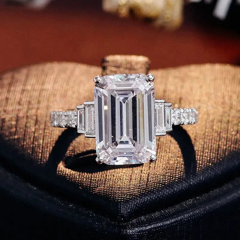 Silver ring with emerald-cut clear zirconia and side baguette stones