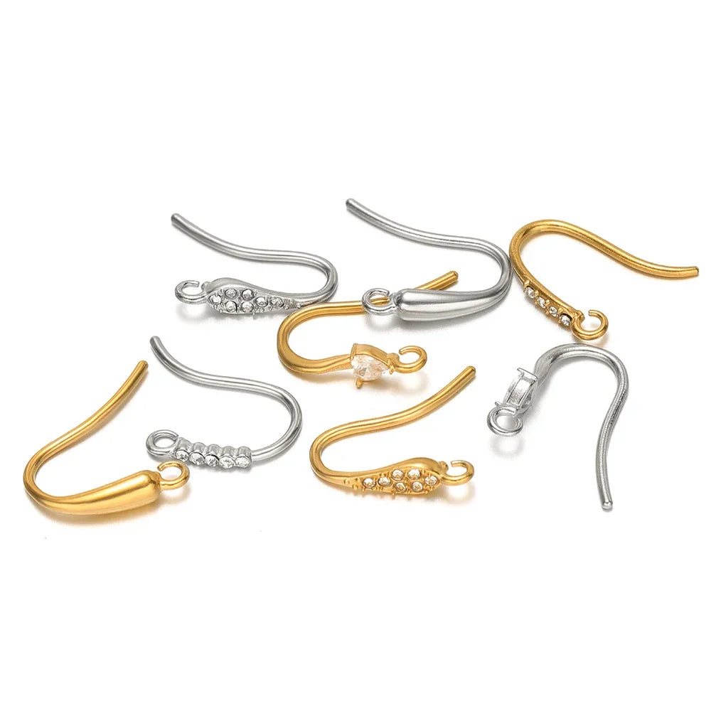Assorted silver- and gold-tone earring hooks with crystal-stone embellishments