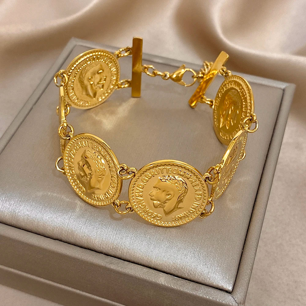 Gold coin charm bracelet with clasp and round medallion links