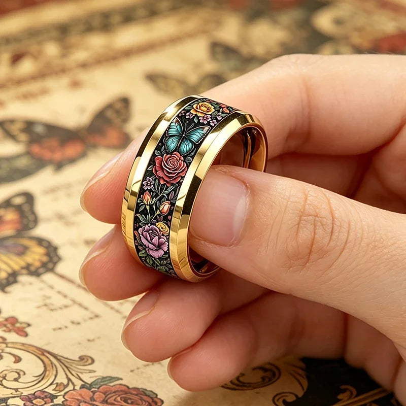 Floral butterfly stainless steel ring worn on finger, black band with gold inner