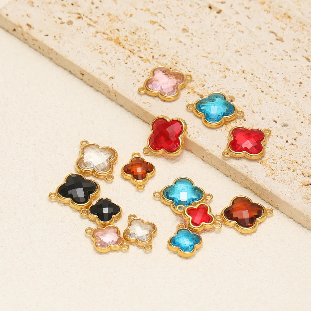 Mixed-color clover glass pendant charms with gold-tone frames and connector loops