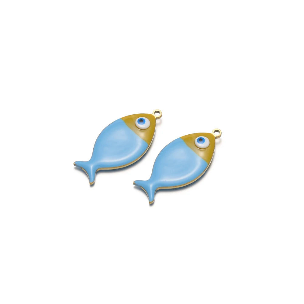 Two pale blue enamel fish charms with gold-tone loops and blue eye accents