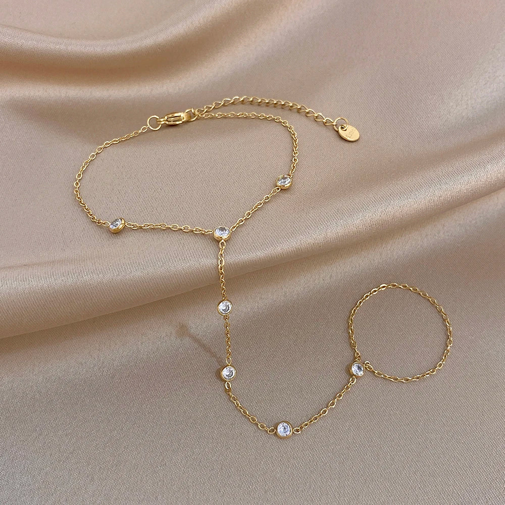 Gold zircon bead link bracelet with small round stones and matching open-ring bracelet