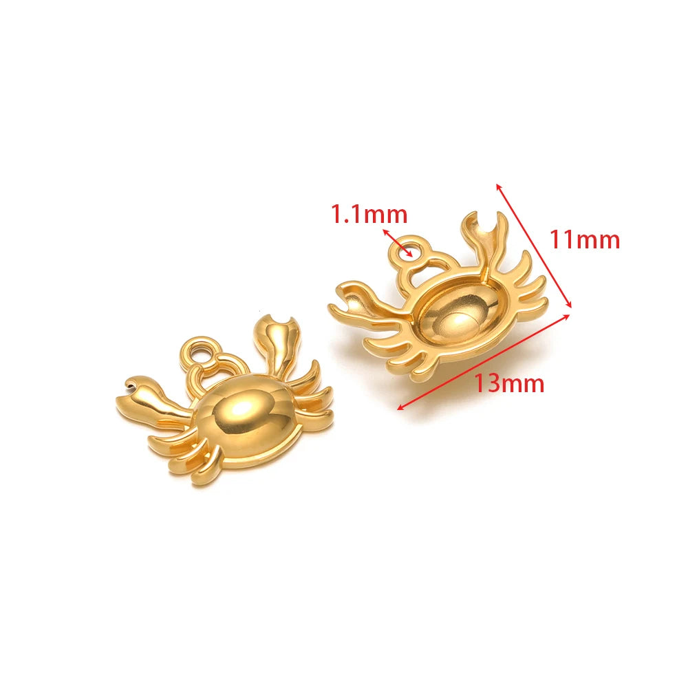 Crab-shaped gold-tone charm with connector loop