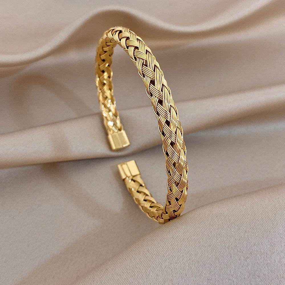 Gold-tone braided bracelet with small clasp accents