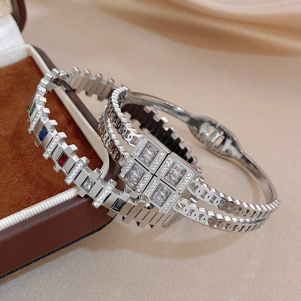 Silver-toned zircon cuff bracelets with rectangular stone grids and colored side accents