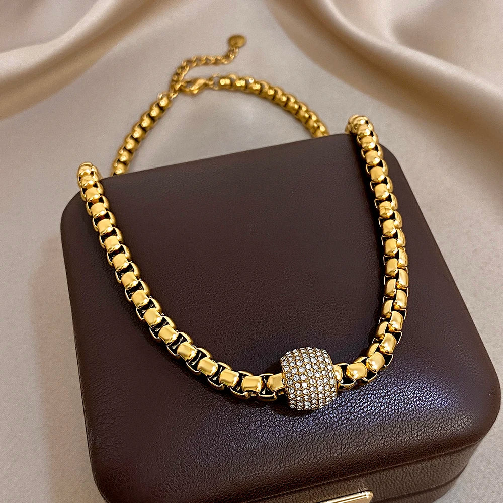 Gold-tone link chain choker necklace with round rhinestone center pendant bead