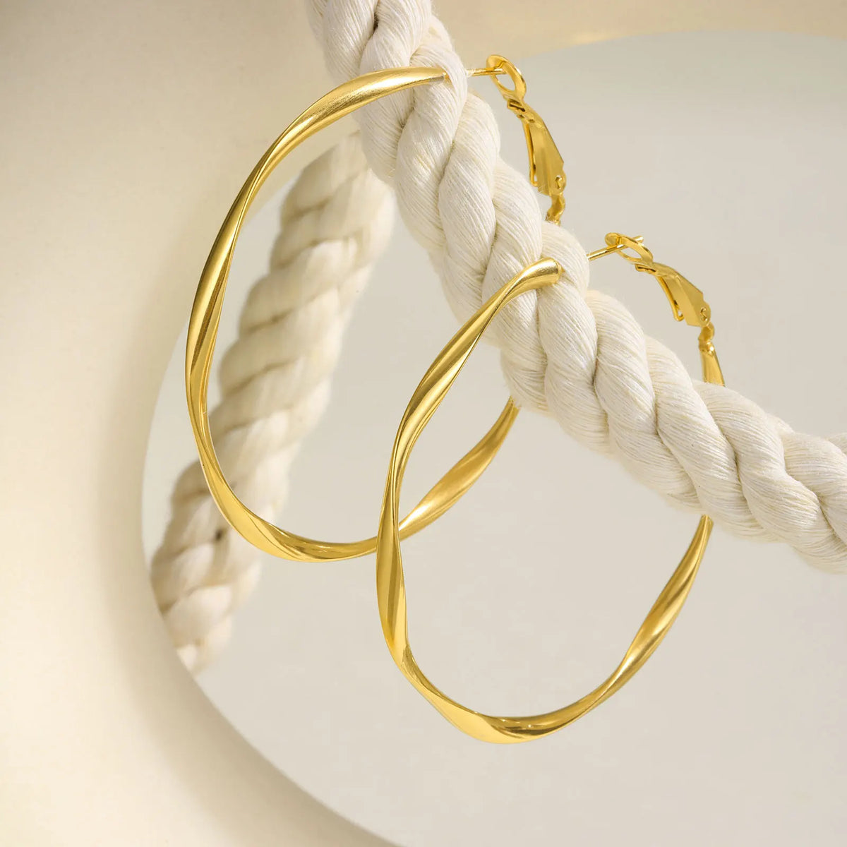 Pair of gold-tone twisted hoop earrings