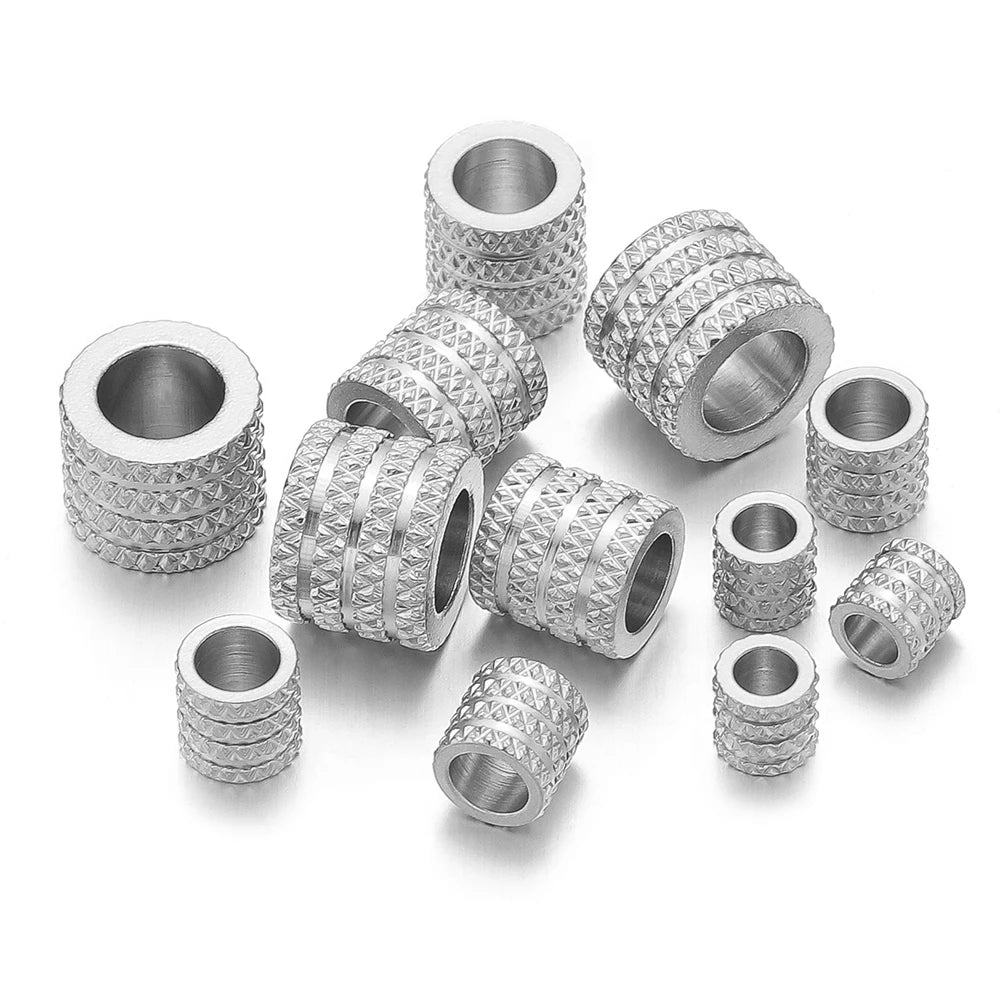 Silver-tone large-hole spacer beads with textured diamond pattern, multiple sizes shown