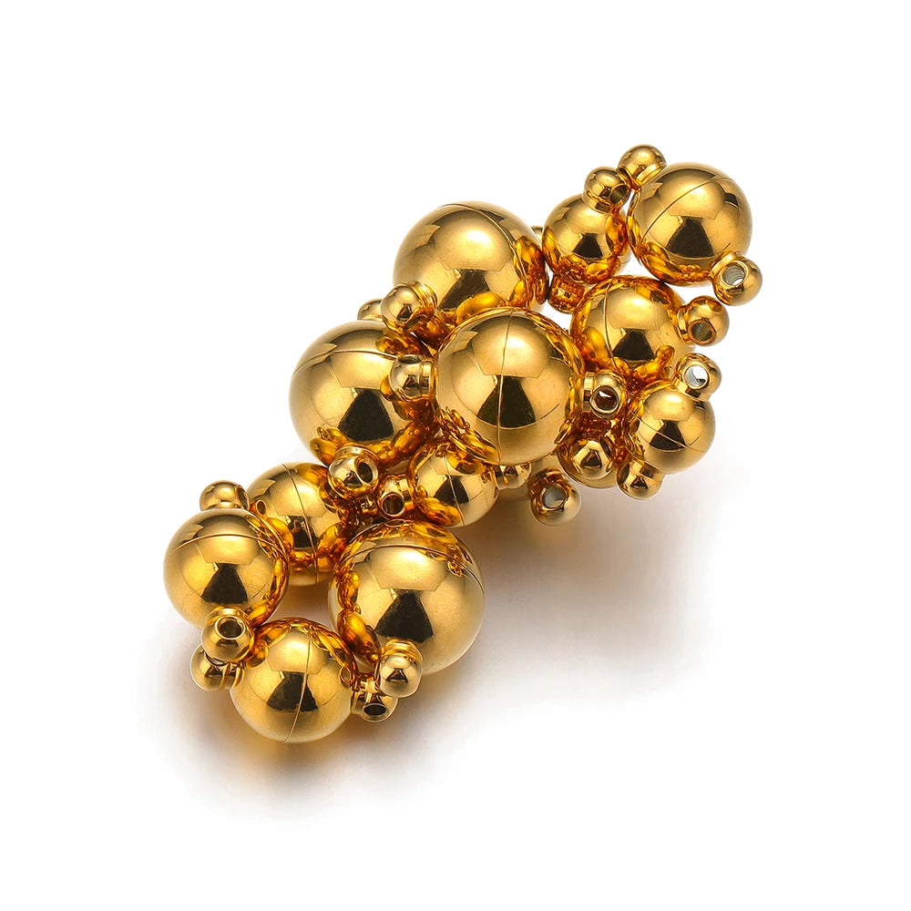 Gold round ball magnetic clasp connectors, close-up of multiple units
