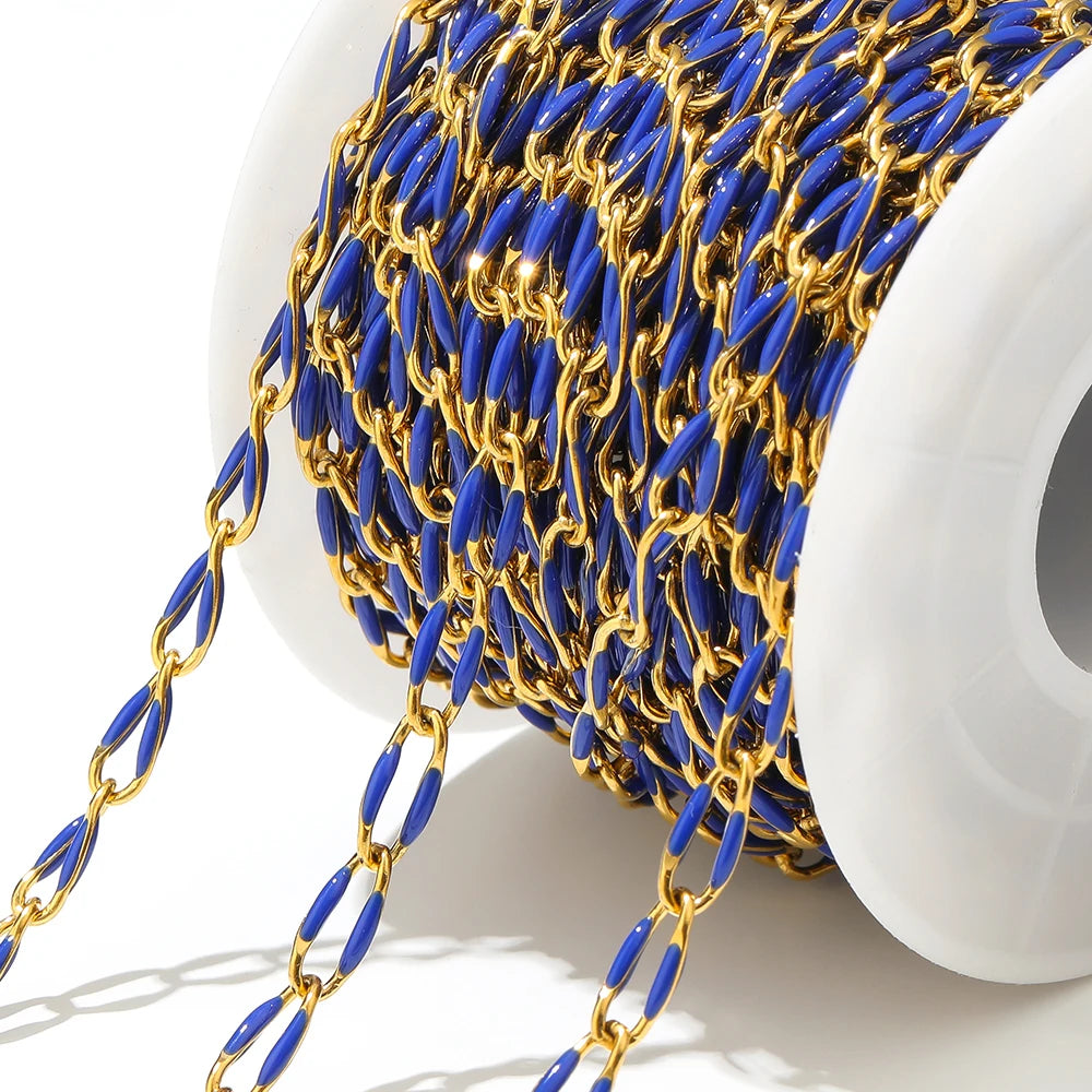 Twisted enamel chain blue and gold oval links on a spool with hanging chain