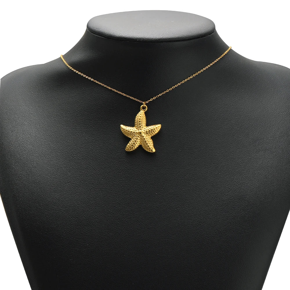 Gold starfish pendant on a thin chain necklace, small loop bail