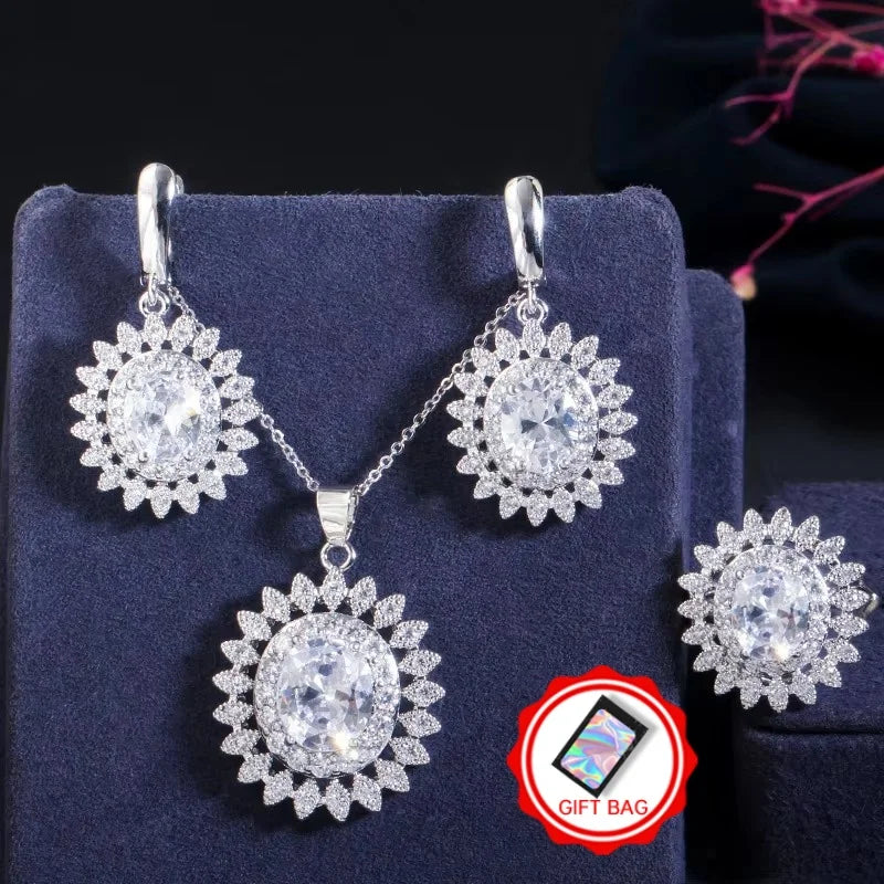 Clear oval cubic zirconia jewelry set with flower-halo earrings, pendant necklace, and ring