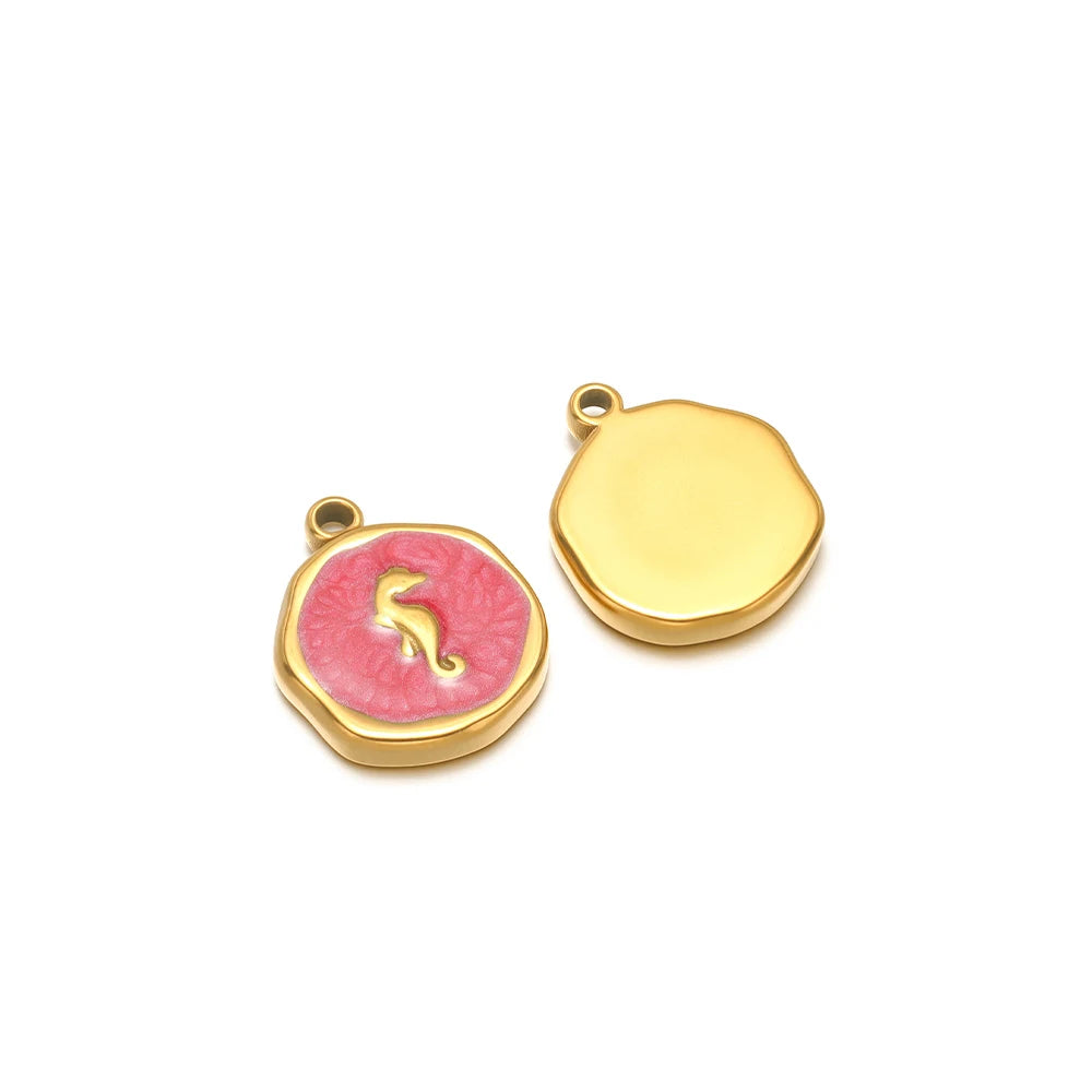 Enamel shell charm pendants, one red with gold seahorse design and one yellow plain cap