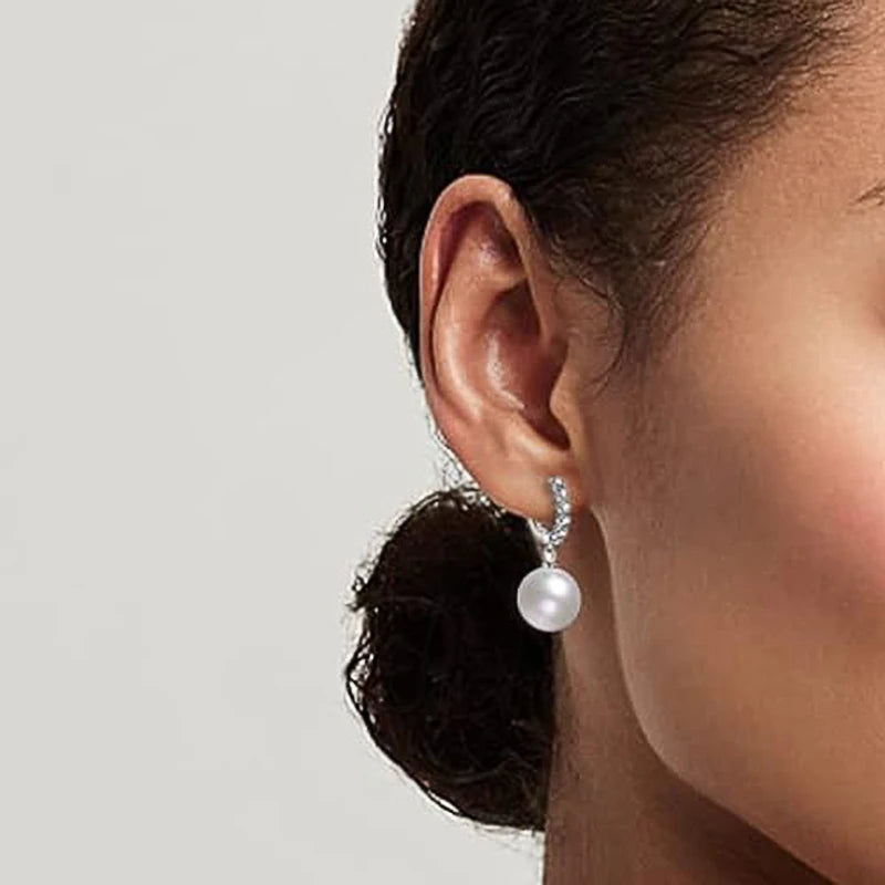 Silver-tone zirconia hoop earrings with dangling round pearl drop