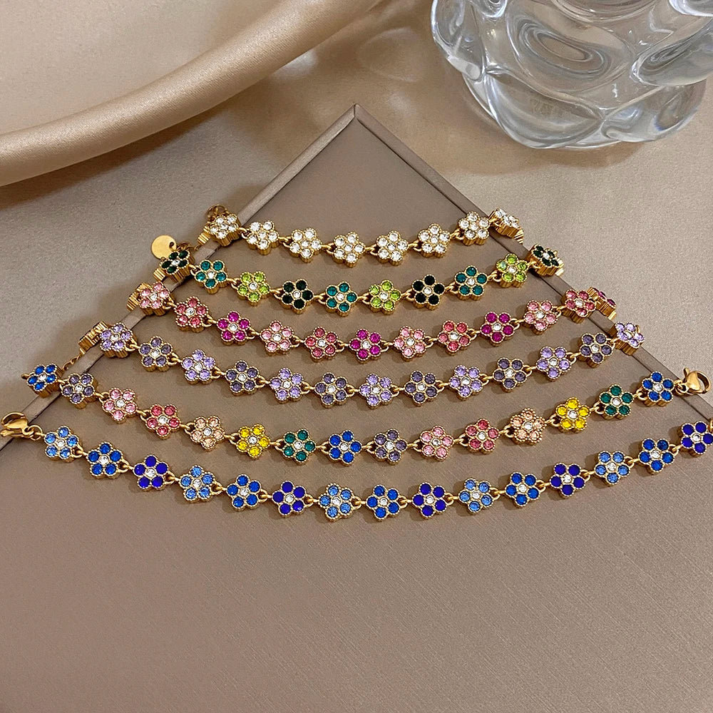 Gold-tone chain bracelet with multicolor flower zircon beads and small round link extension