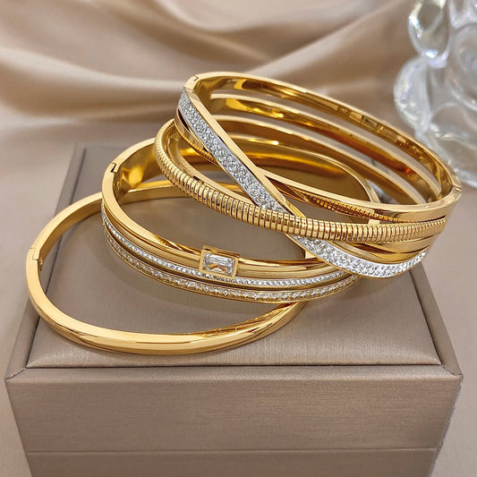 Gold-plated stainless steel cuff bangles with zircon accents, stacked together