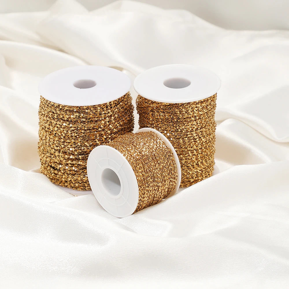Gold plated flat flower chain on white spools, bundled rolls for jewelry making