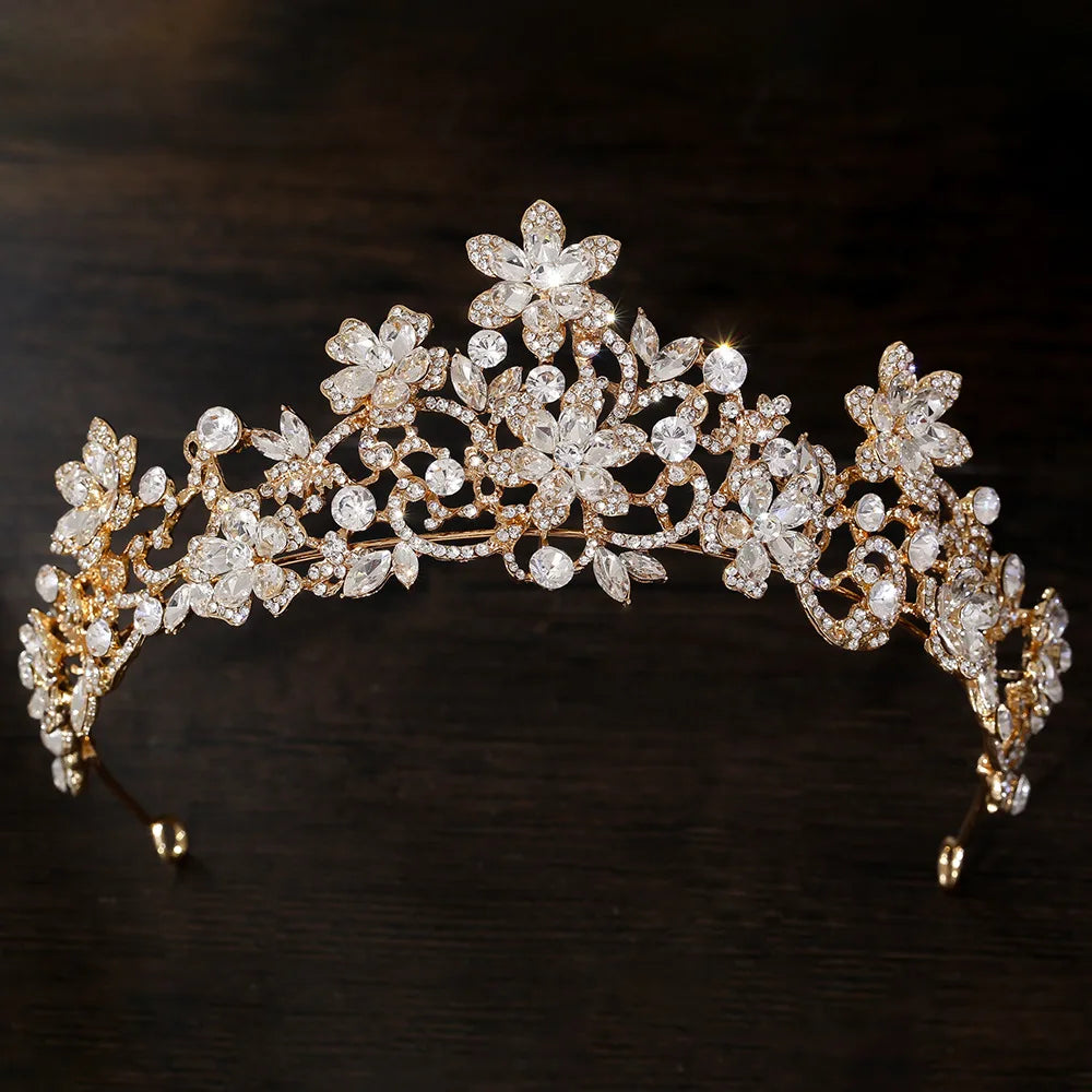Rhinestone floral tiara with clear white crystals and gold-tone curved design