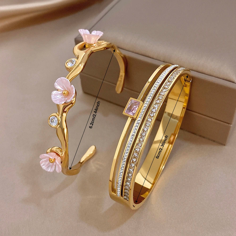 Gold-plated cuff bangle set with pink flower branch charms and sparkling rhinestone rows