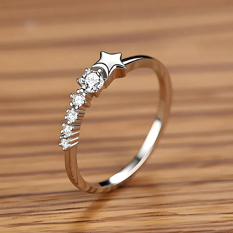 CZ ring with star accent and five stones