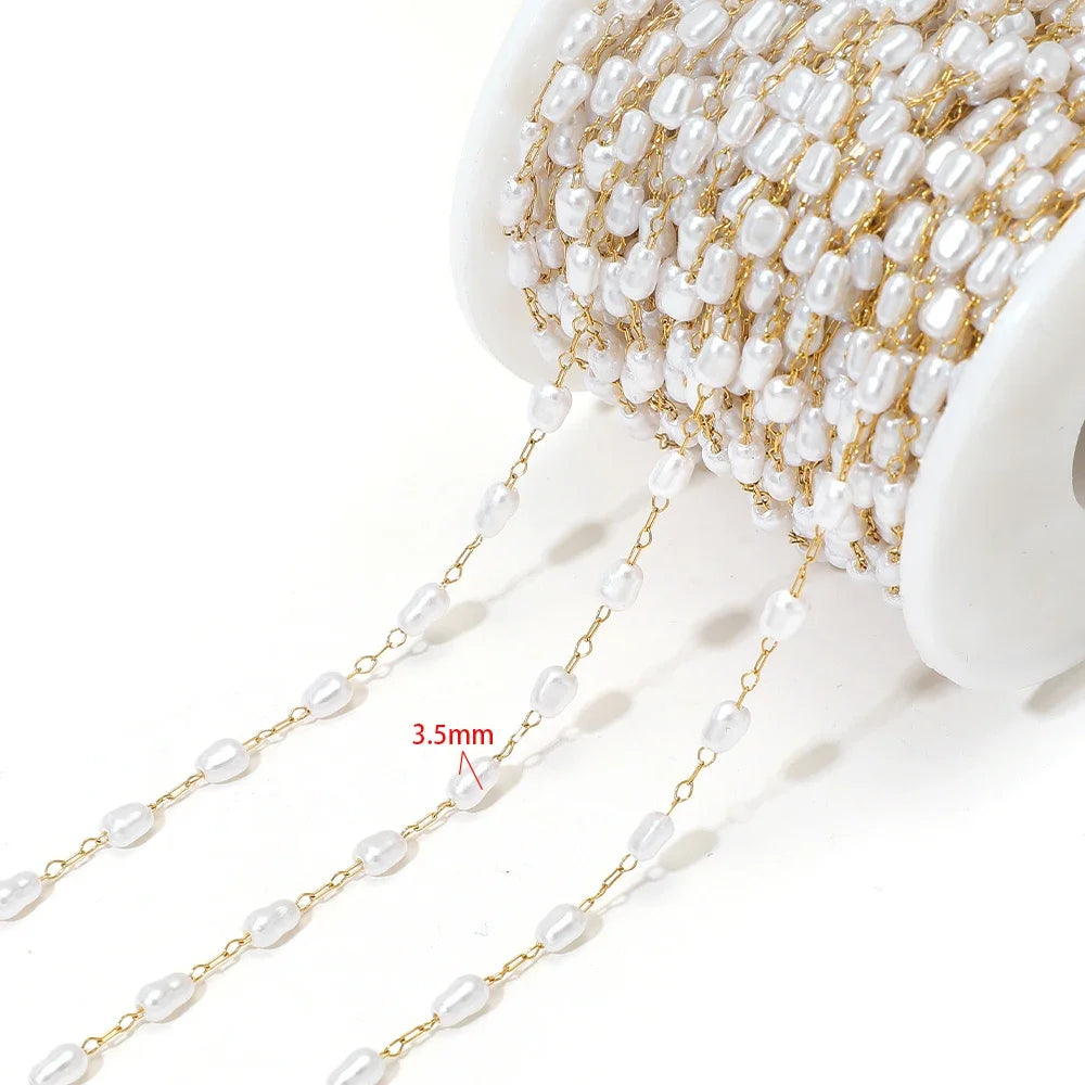 Artificial pearl chain with gold links and 3.5mm white oval beads