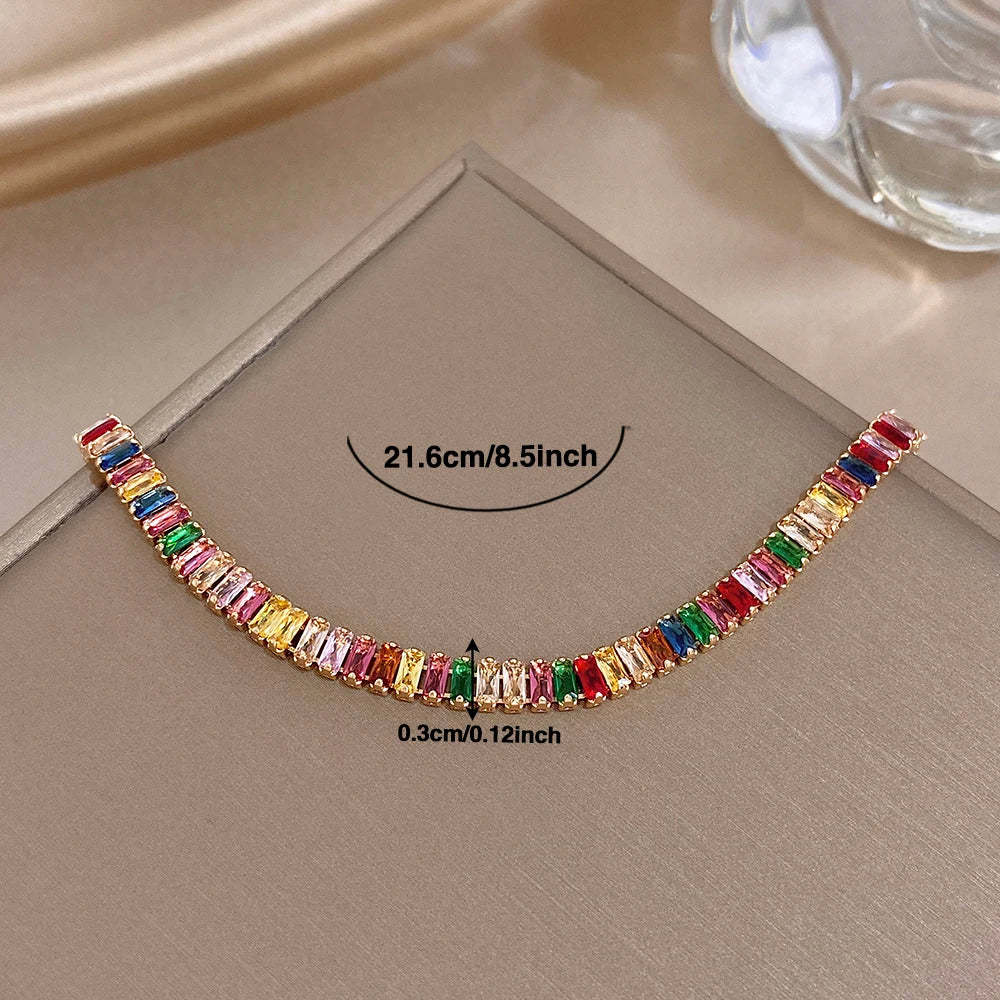 Gold-tone rainbow zircon tennis bracelet with multicolor baguette stones and clasp