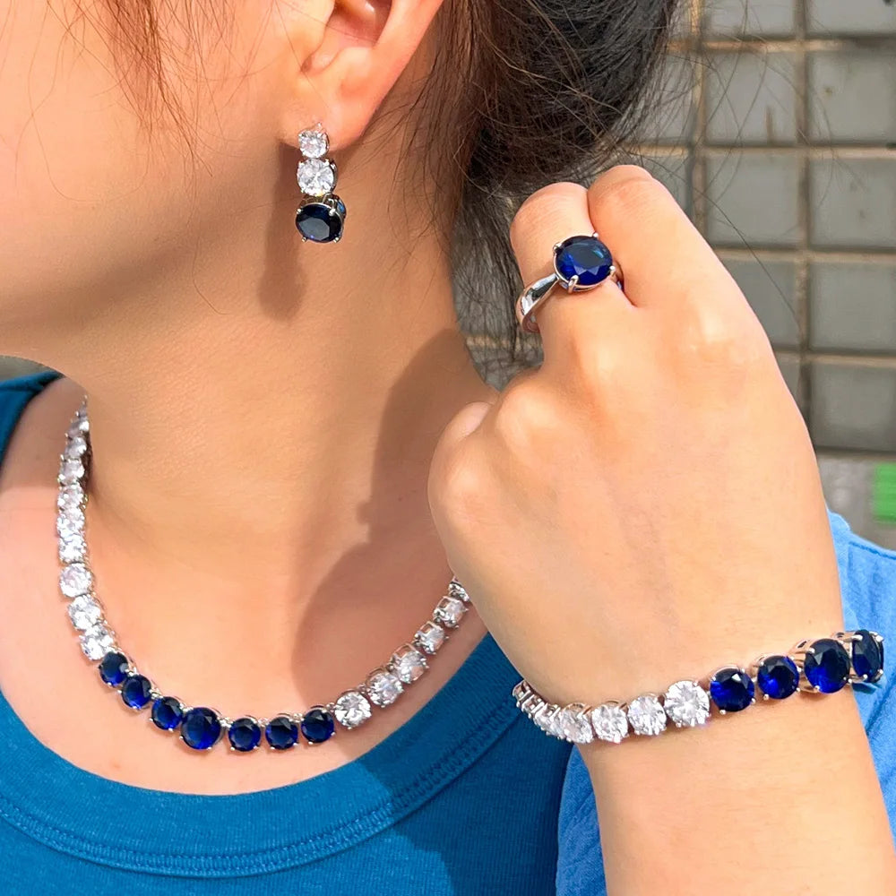 Blue cubic zirconia tennis jewelry set: necklace, bracelet, ring, and earrings