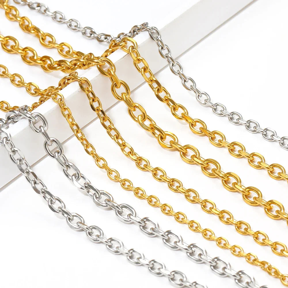 Gold and silver O-link chain strands with interlocking oval links on white backing