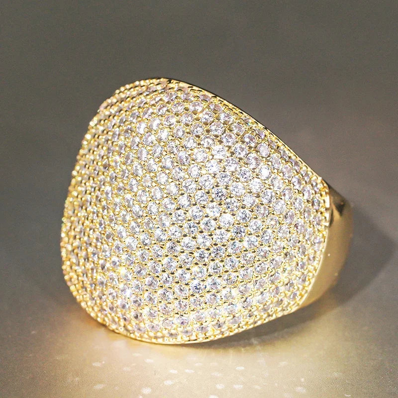 Cubic zirconia ring with large domed pavé setting in gold-tone metal