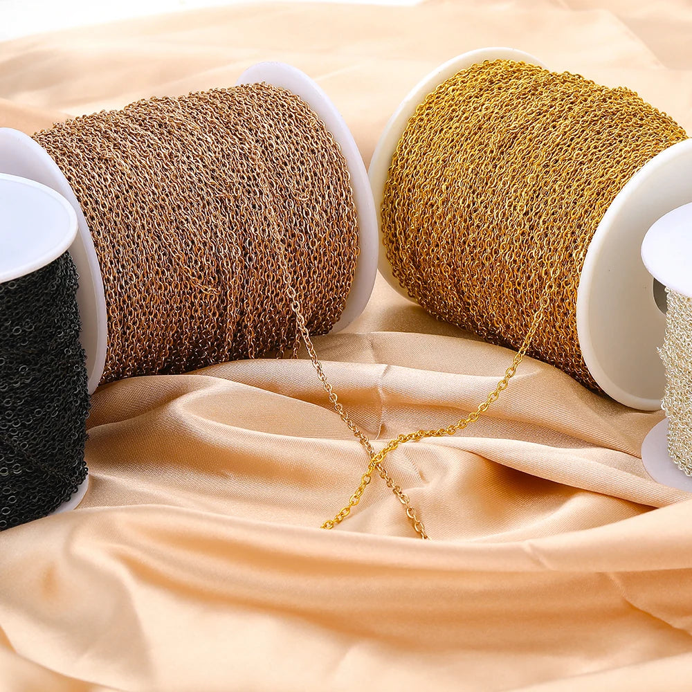 Gold-tone stainless steel chain links on two spools with hanging chain