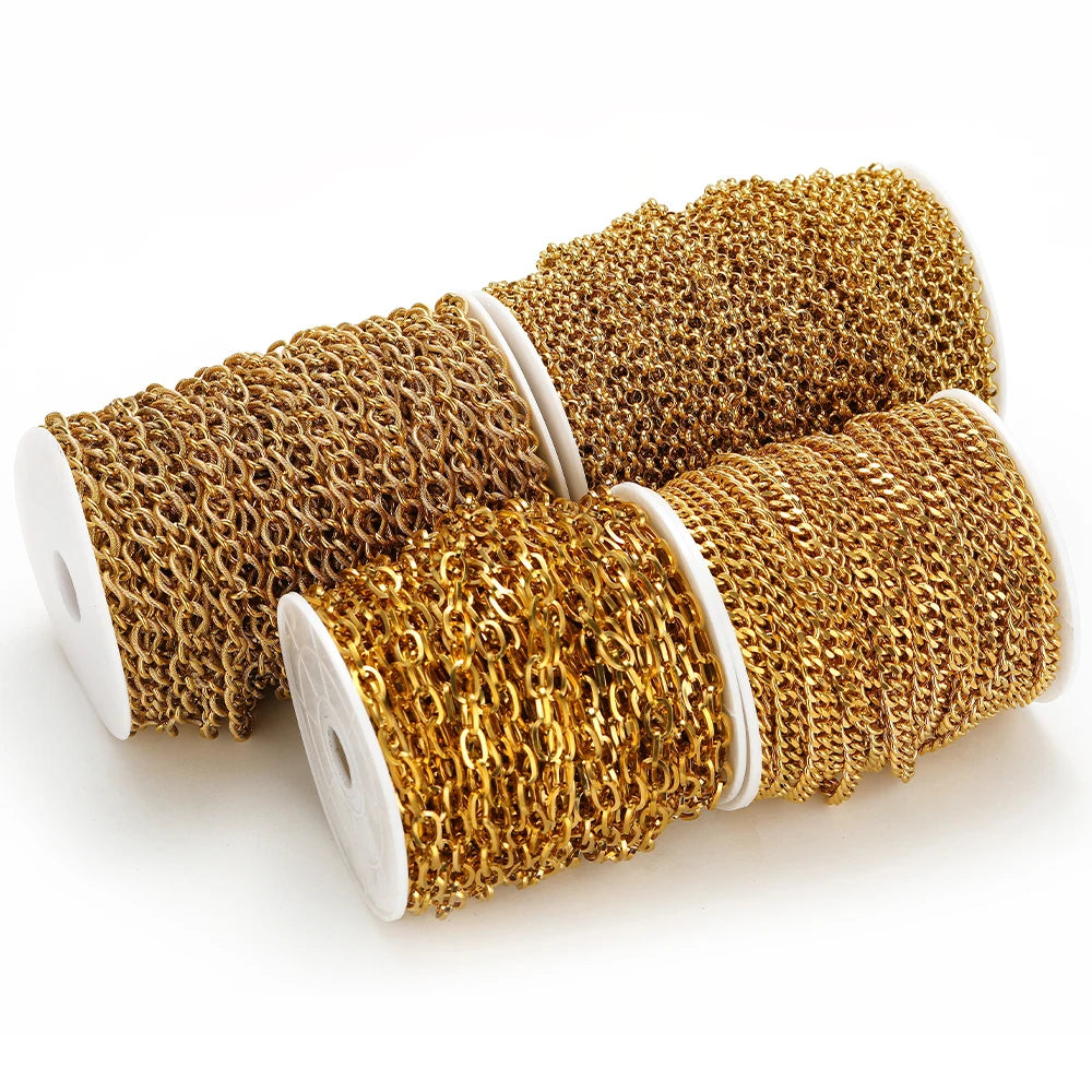 Gold Cuban link chain rolls on white spools, chunky chain links