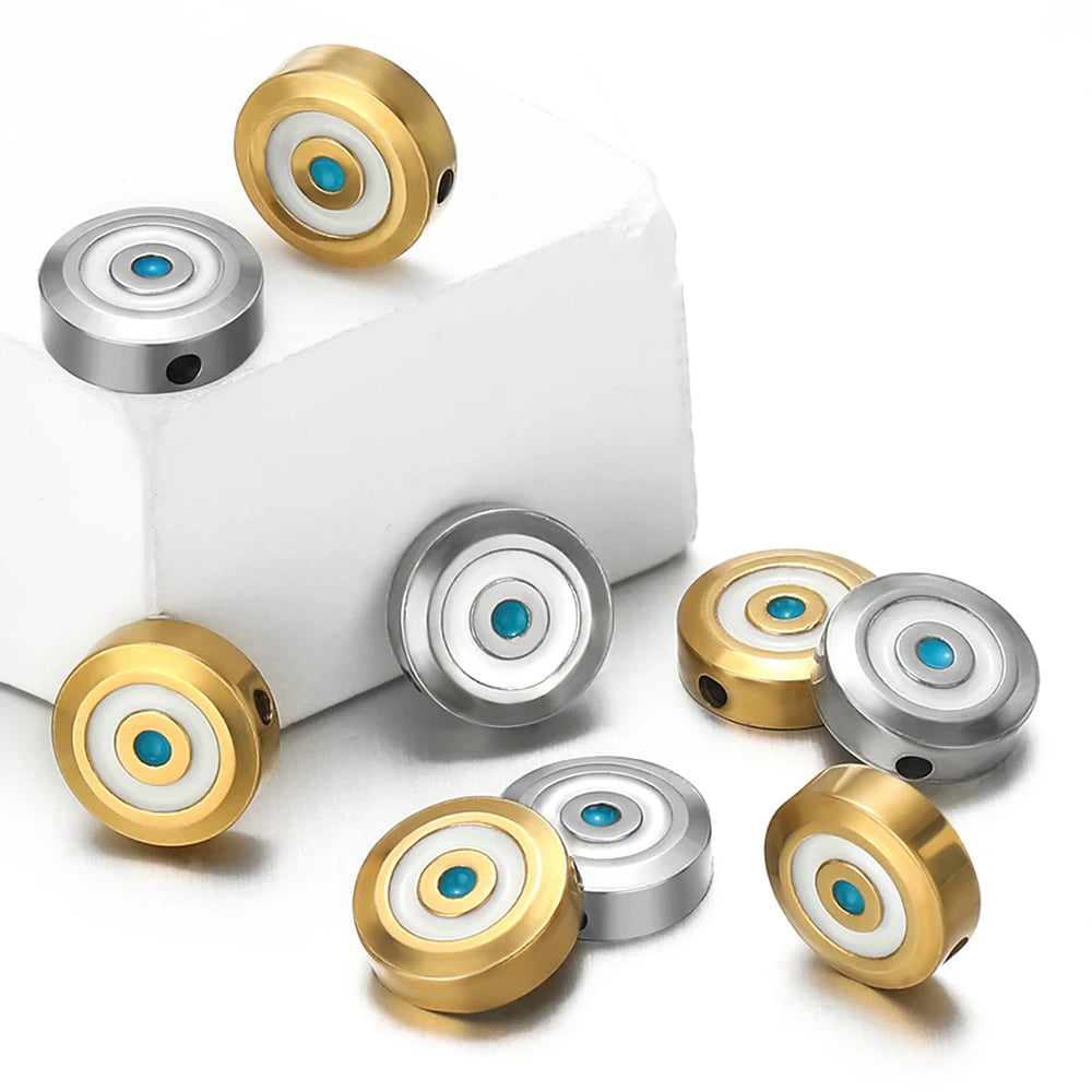 Mixed gold and silver-tone evil-eye enamel beads with blue center on a jewelry base