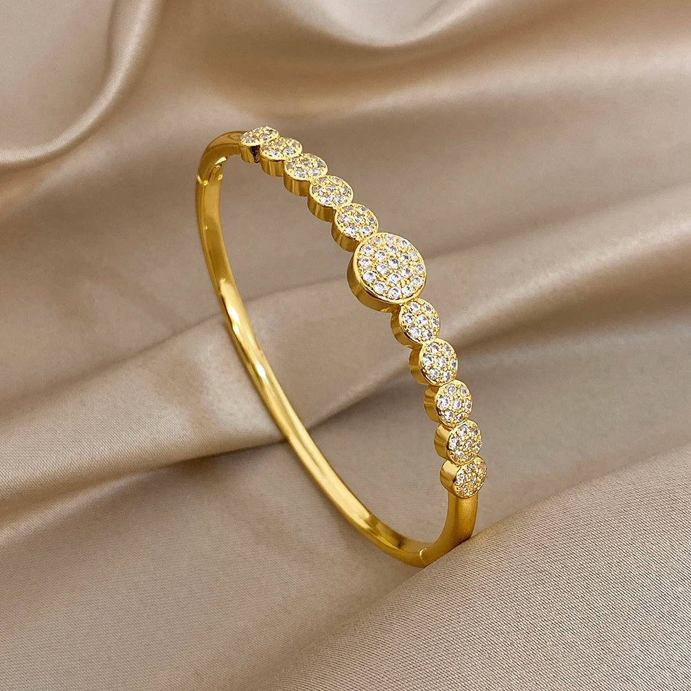 Gold-plated cuff bangle with round zircon accents