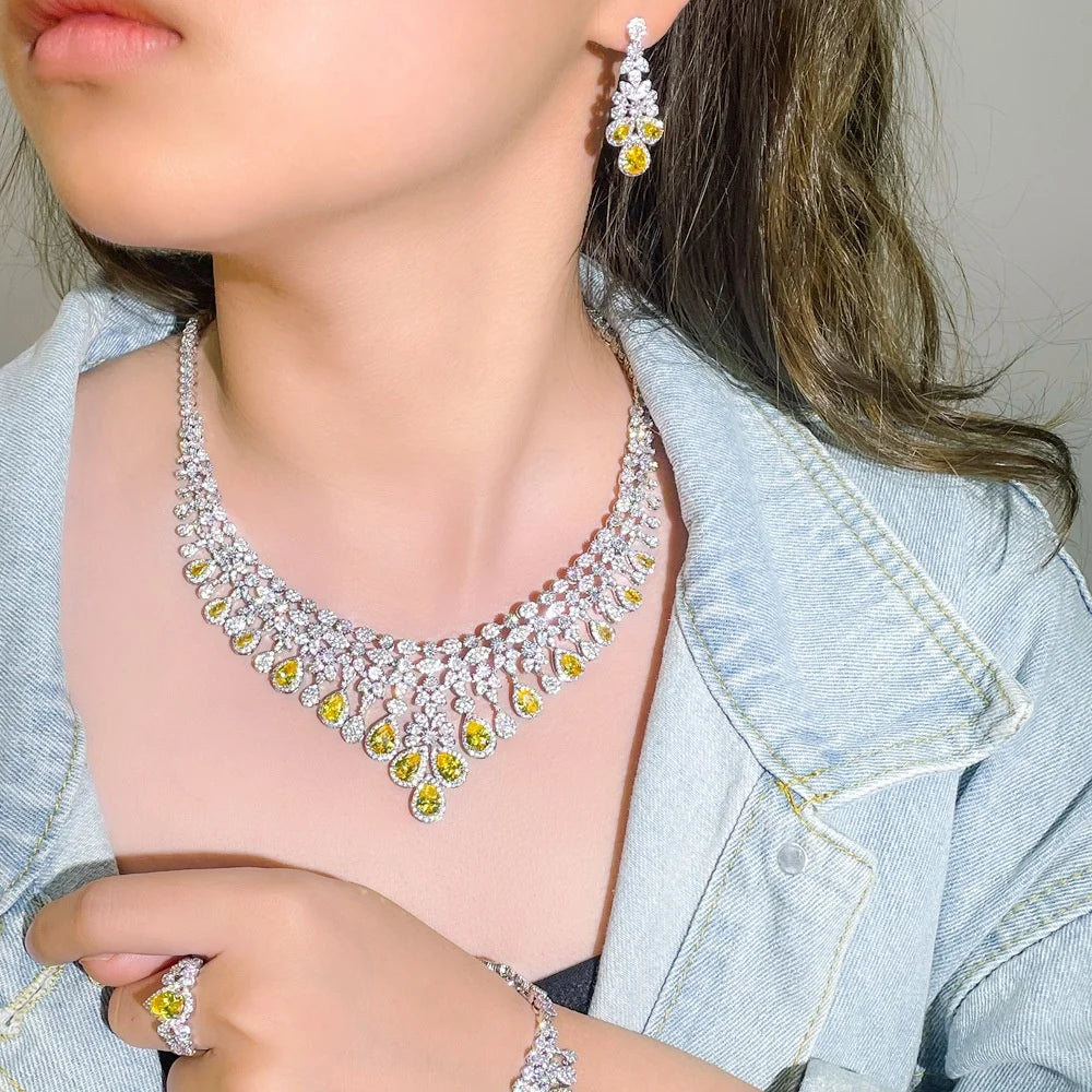 Diamond-style bridal necklace with matching hoop earrings, yellow teardrop crystal details