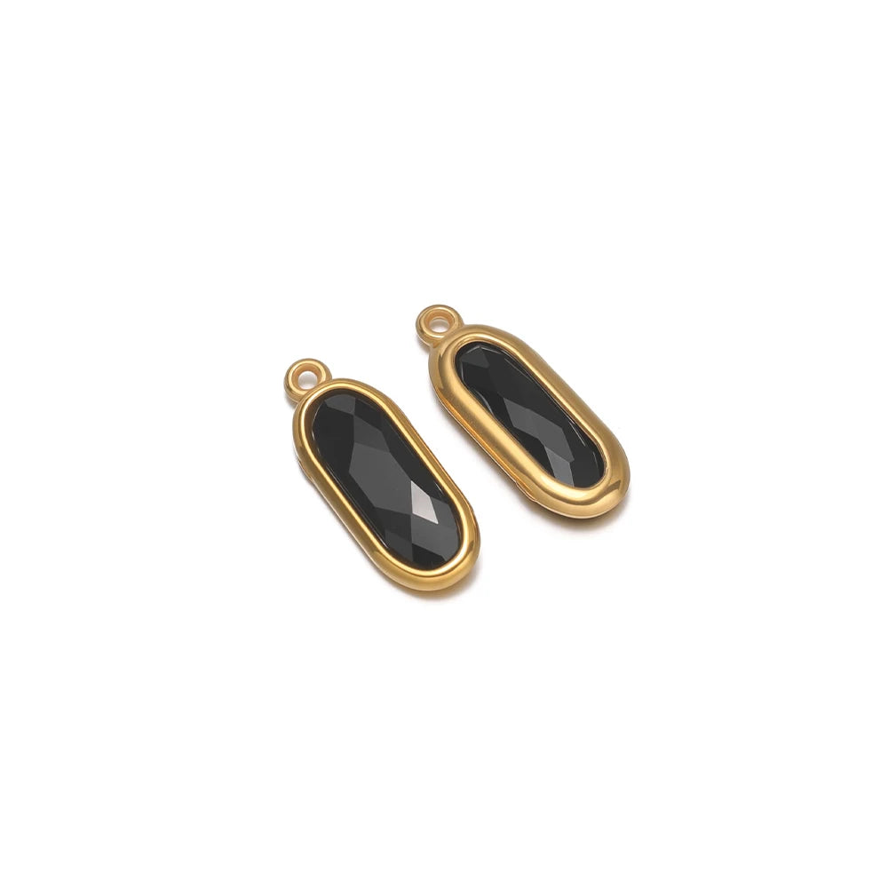 Oval glass charm connectors, black faceted glass in gold bezels, with loops