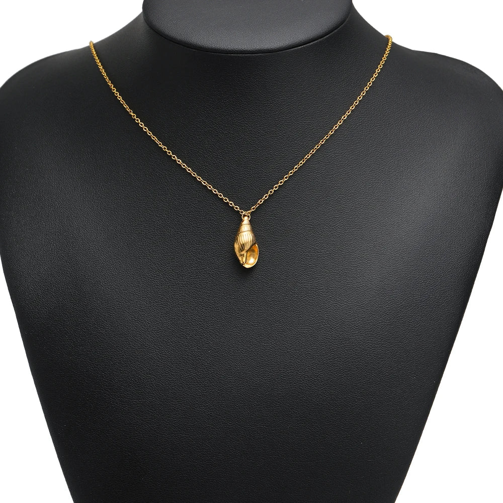 Gold conch shell pendant necklace charm on a chain