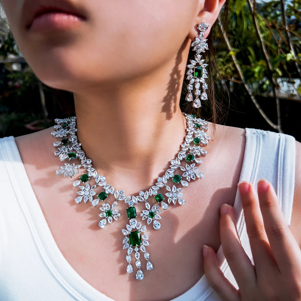 Floral cubic zirconia necklace with green stones and matching drop earrings