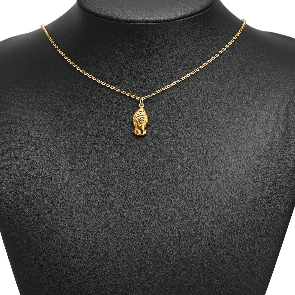 Gold hollow fish charm pendant on a necklace chain