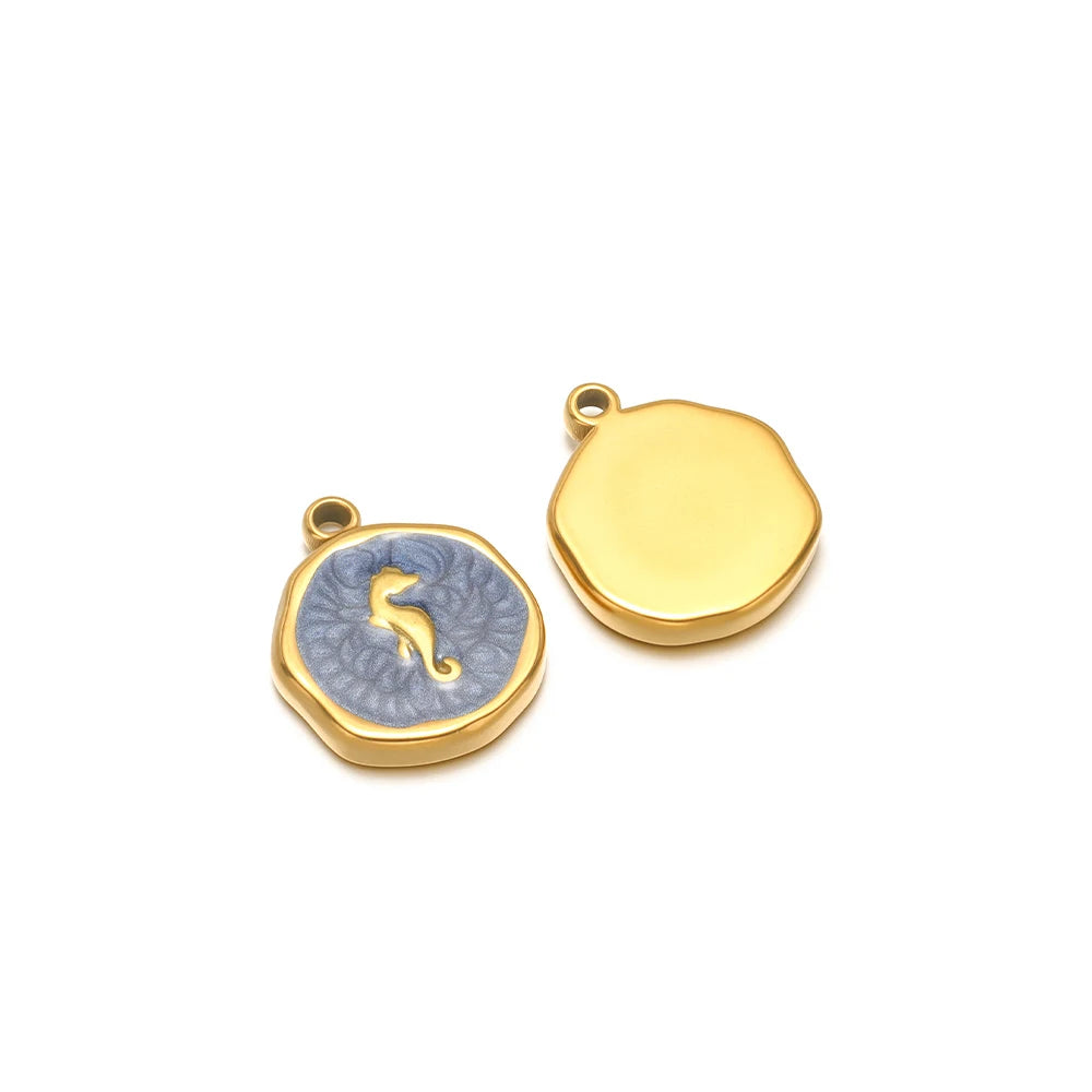 Enamel shell charm pendants, one blue with gold seahorse design and one yellow plain cap